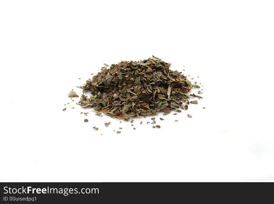 A pile of basil on a white background