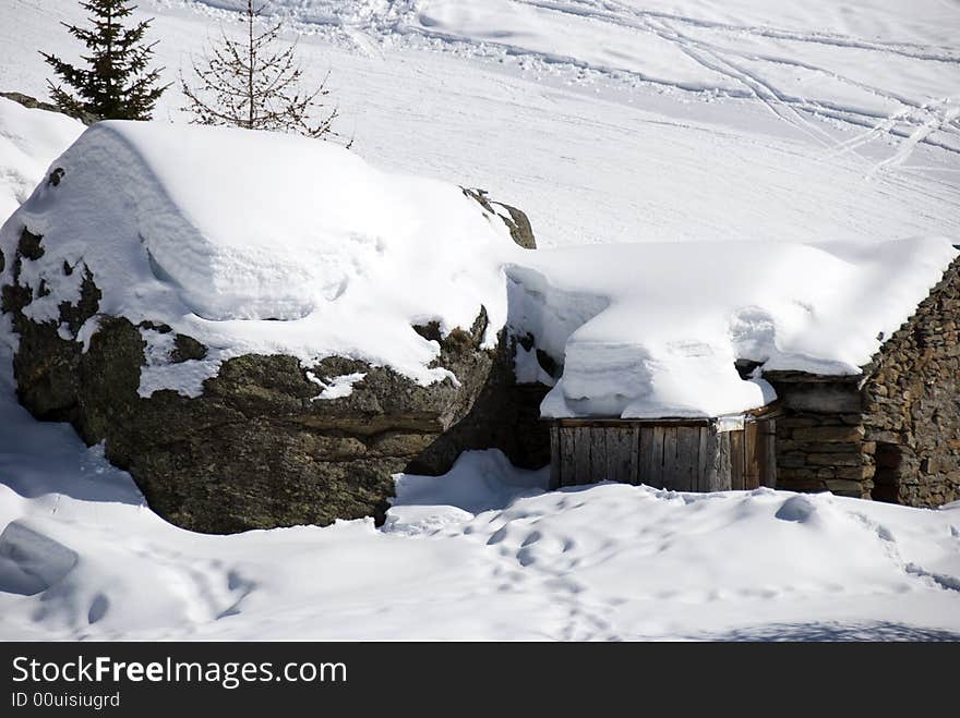 Mountain hut under snow