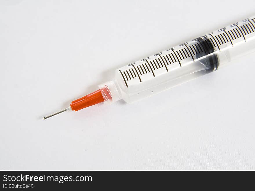 Close up of a Syringe with a safety needle on it. Close up of a Syringe with a safety needle on it.