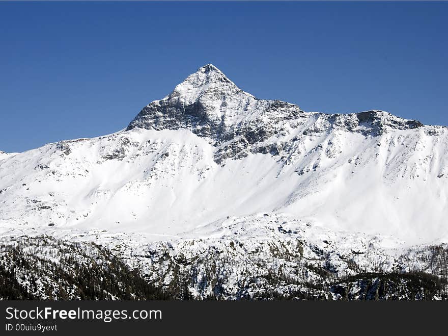 A close up of Pizzo Scalino mountain after a snowfall - Italy. A close up of Pizzo Scalino mountain after a snowfall - Italy