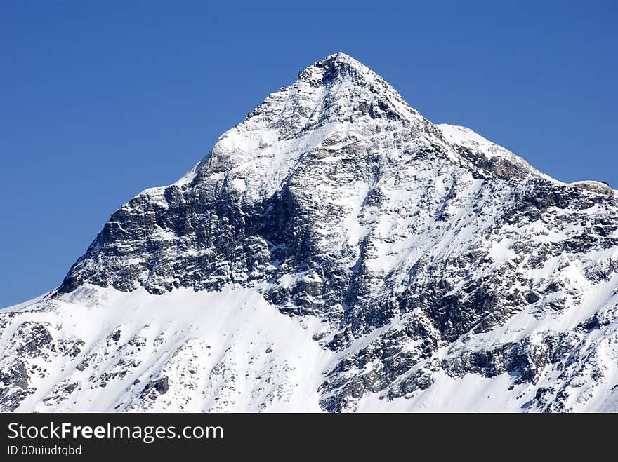 A close up of Pizzo Scalino mountain after a snowfall - Italy