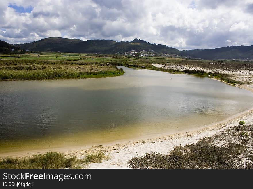 Lake near a beach with aquamarine water. Lake near a beach with aquamarine water