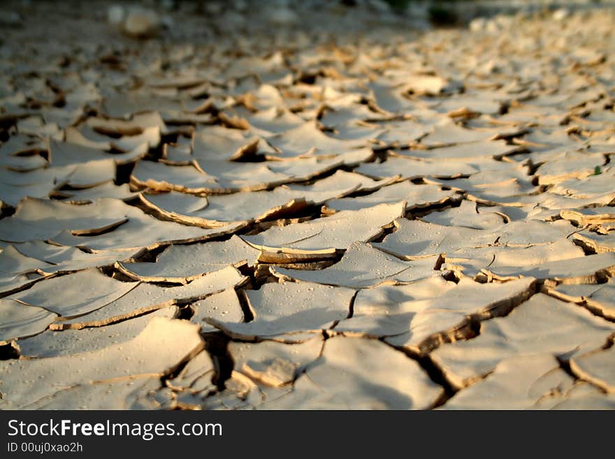 Dry mud creative cracks in the desert land. Dry mud creative cracks in the desert land.