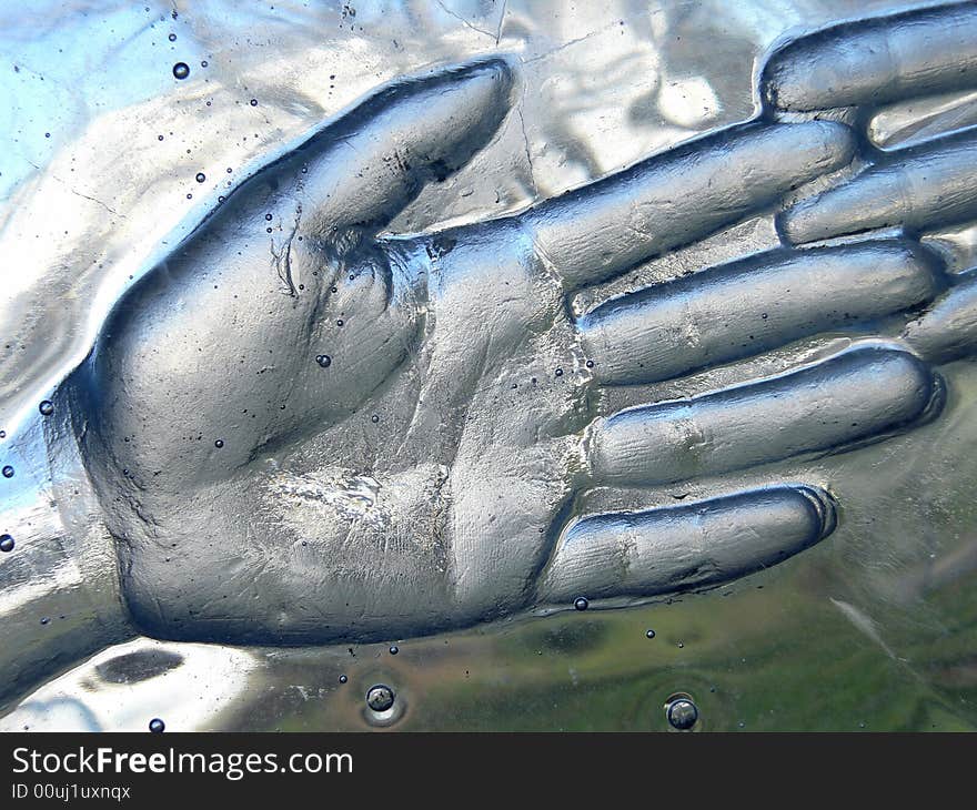 Print of a hand in glass close up. Print of a hand in glass close up