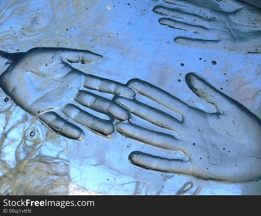 Print of two hands in glass. Print of two hands in glass