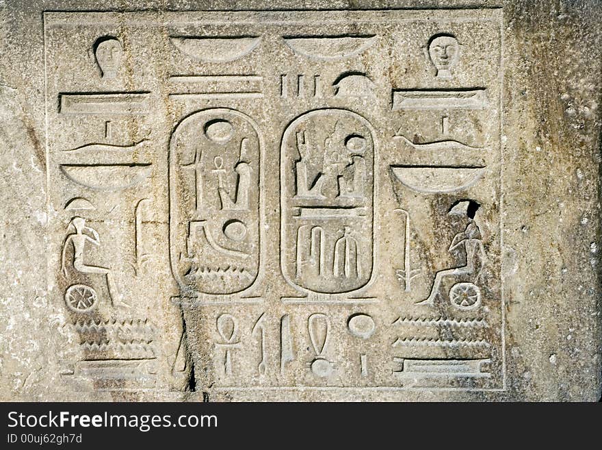 Egyptian symbols and texts carved in stone. Egyptian symbols and texts carved in stone