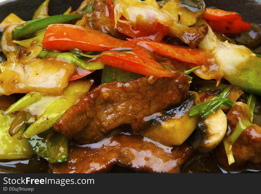 Fried meat with the vegetables and the specific sauce