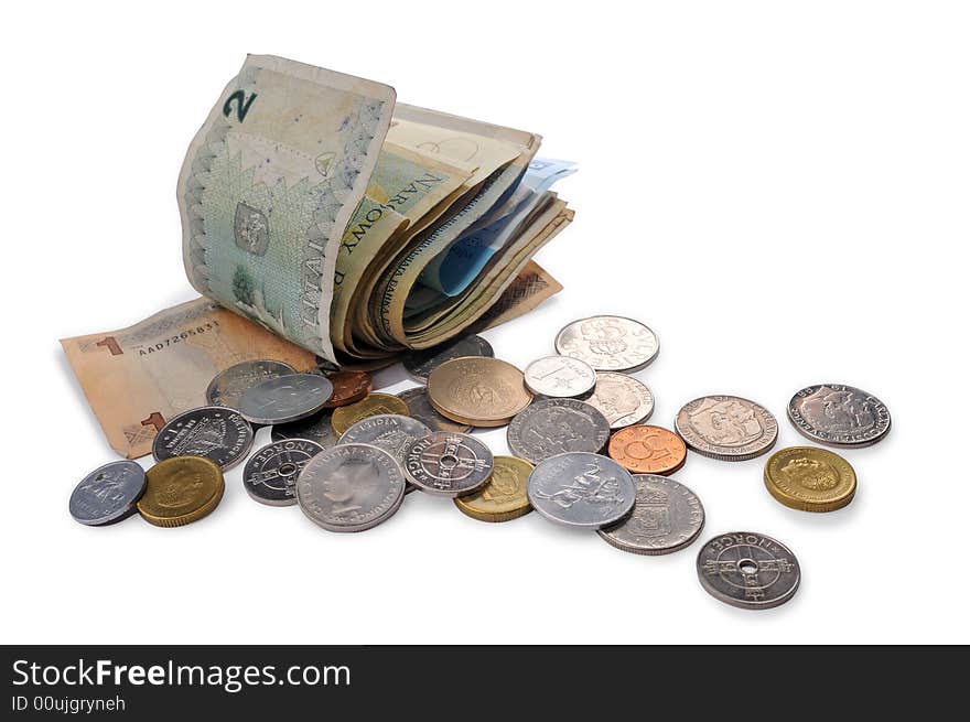 Banknotes and coins spread randomly on a table.