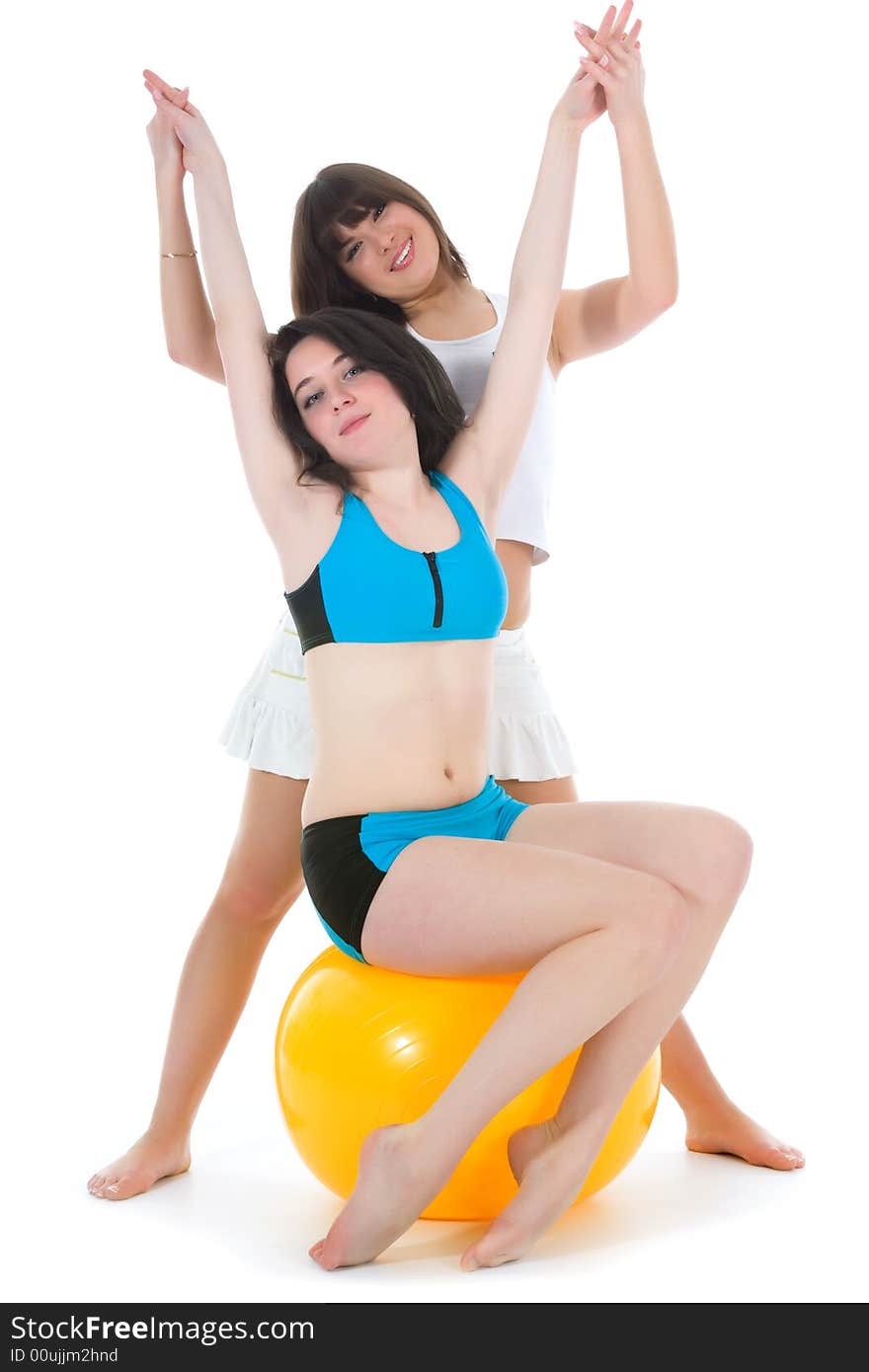 Girls practicing fitness  on  white  background