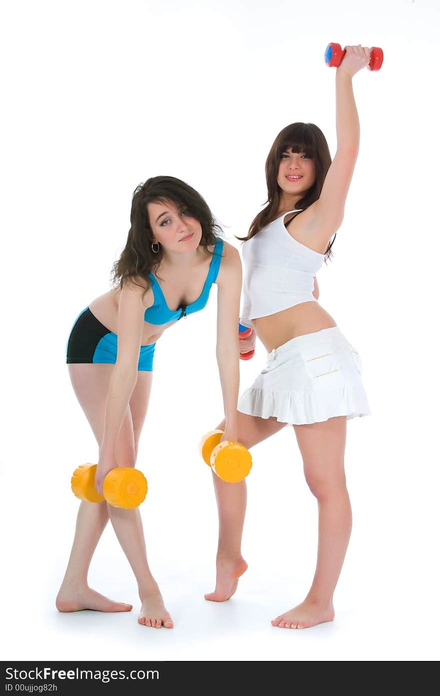 Girls practicing fitness  on  white  background