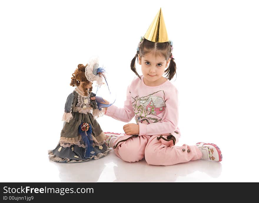 The little girl with a doll isolated on a white background