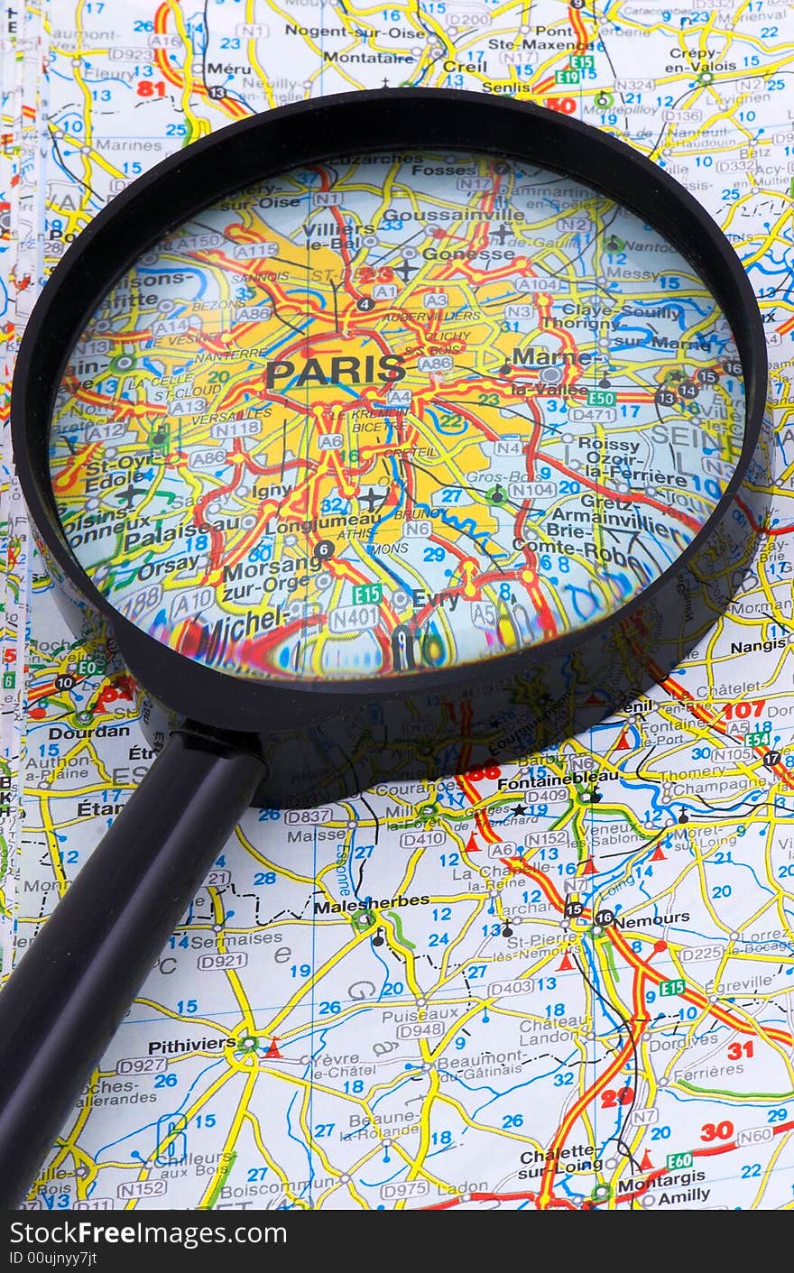 Paris seen through the magnifying glass suggesting touristic destination. Paris seen through the magnifying glass suggesting touristic destination