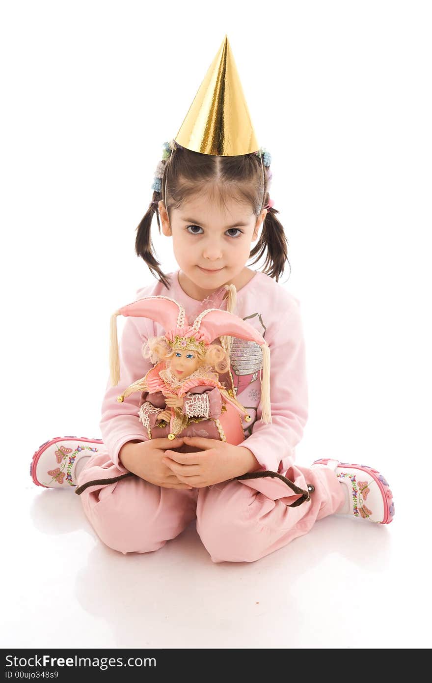 The little girl with a doll isolated on a white background