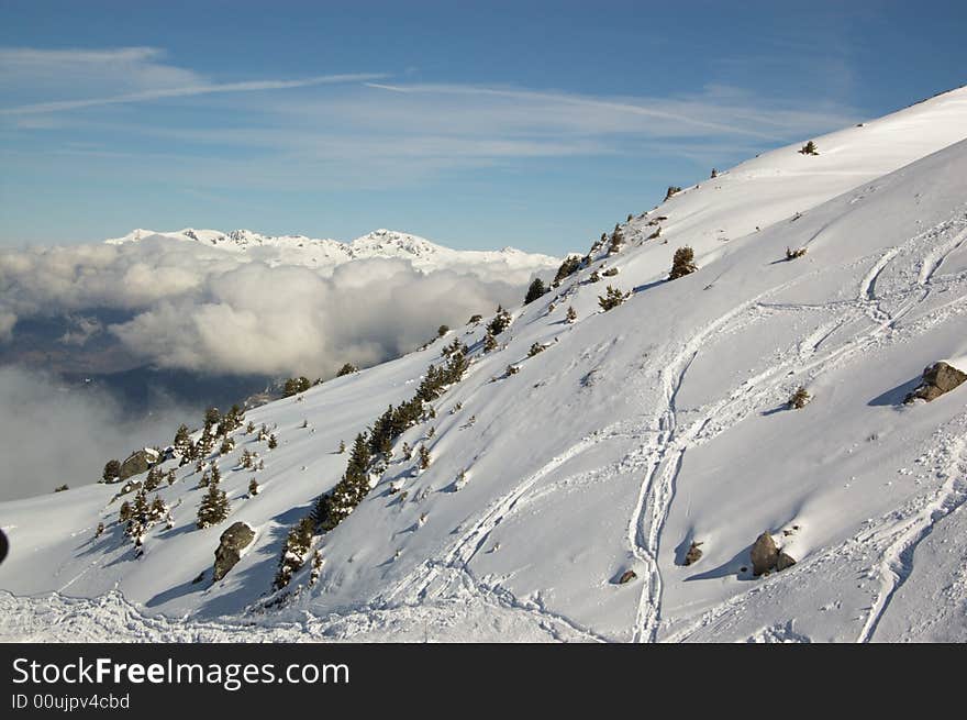 Panoramic view on  cloudy snow winter mountains. Alpes, Switzerland, Europe. Panoramic view on  cloudy snow winter mountains. Alpes, Switzerland, Europe