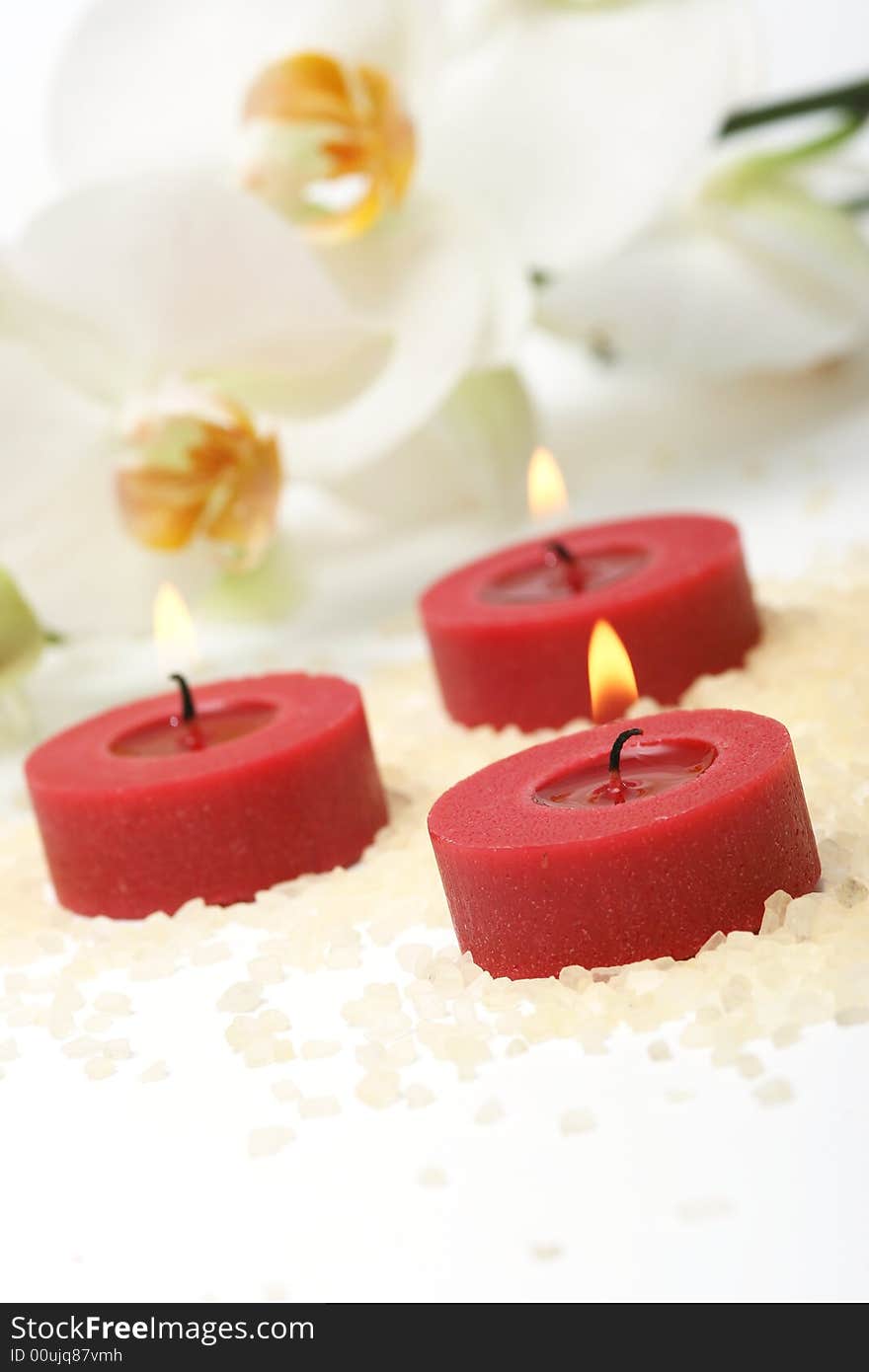 Aromatherapy red candles and white orchid