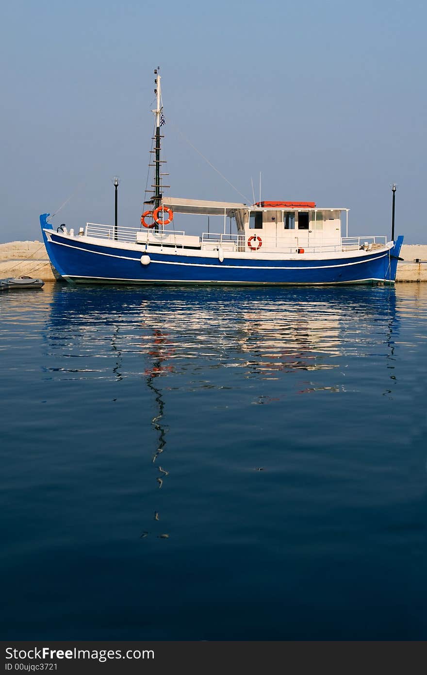 Blue boat ashore on greek evening sun. Blue boat ashore on greek evening sun