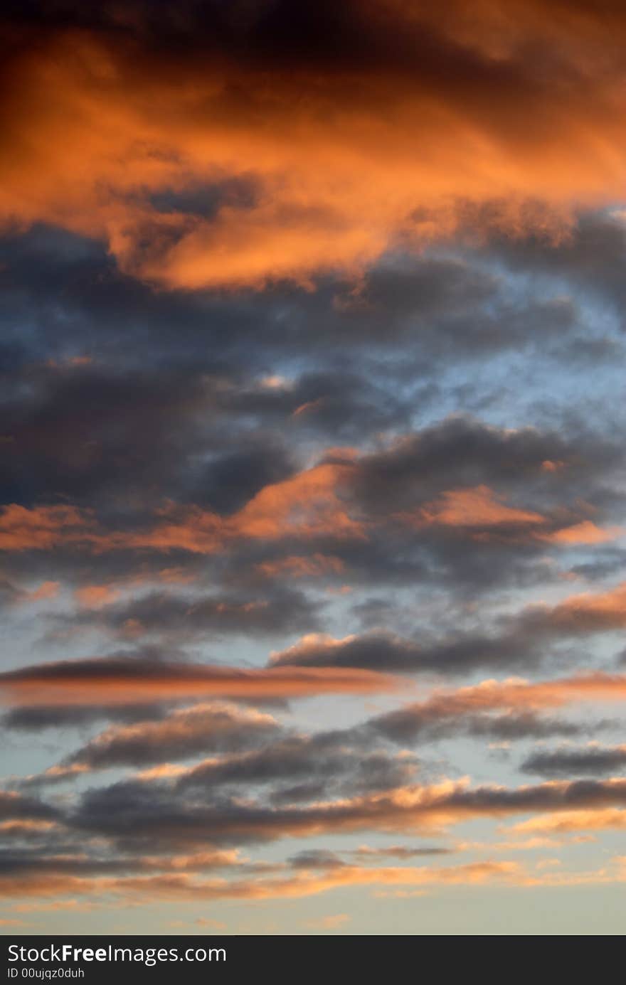 Romantic cloudscape scene, beautiful warm colored clouds