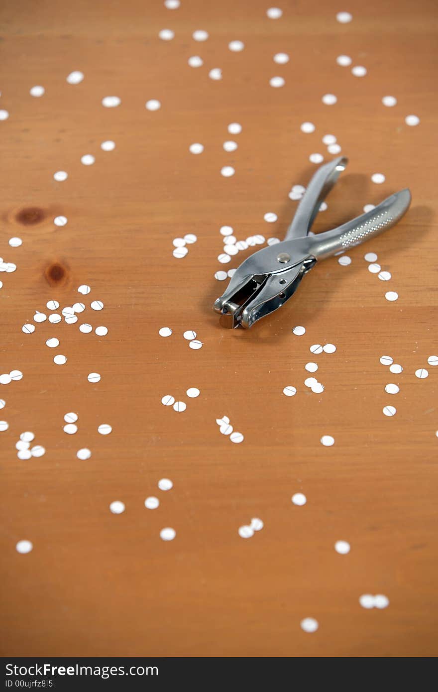 A hole punch on a desk in the office