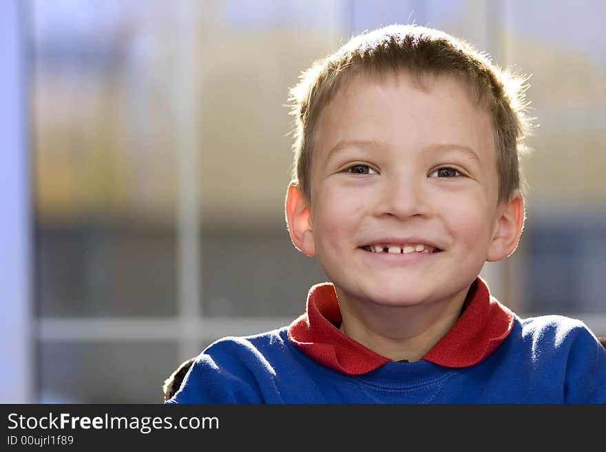 Smiling Boy In Blue Sweatshirt