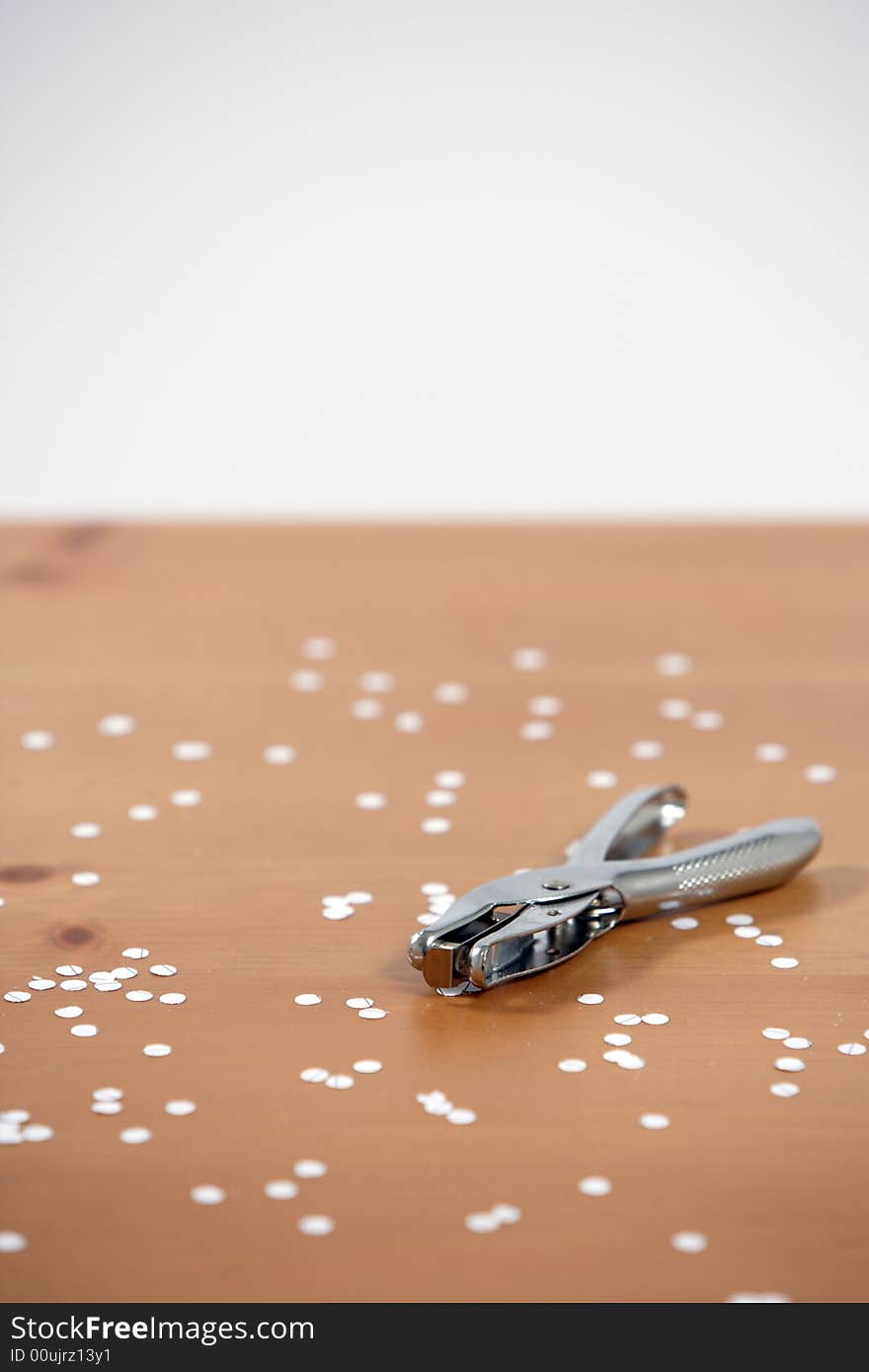 A hole punch on a desk in the office