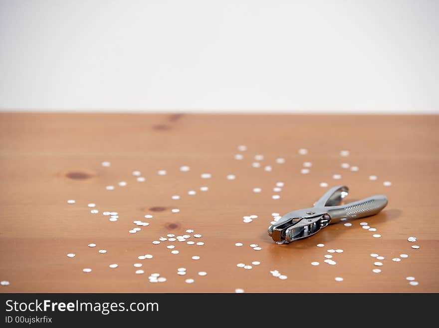 A hole punch on a desk in the office