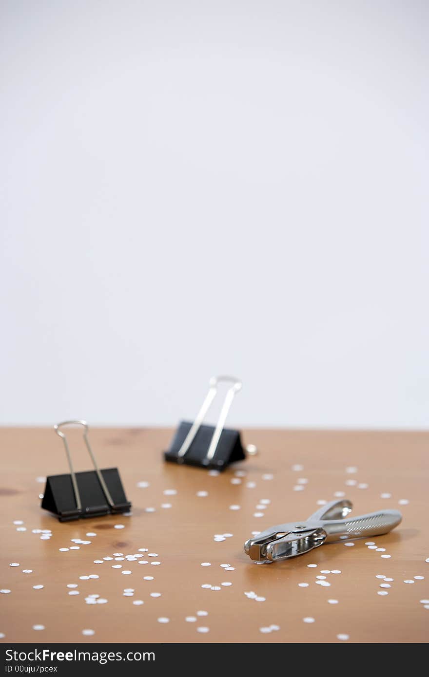 A hole punch on a desk in the office