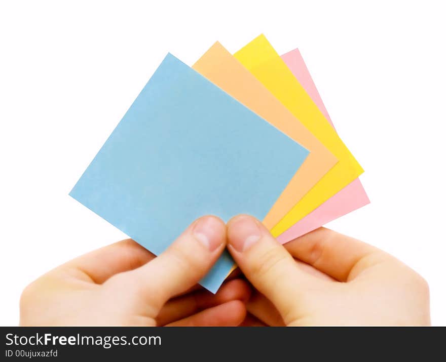 Human hand holding stickers on white