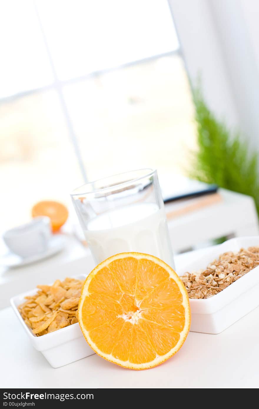 Fast and delicious breakfast / Orange, cornflakes and milk. Fast and delicious breakfast / Orange, cornflakes and milk