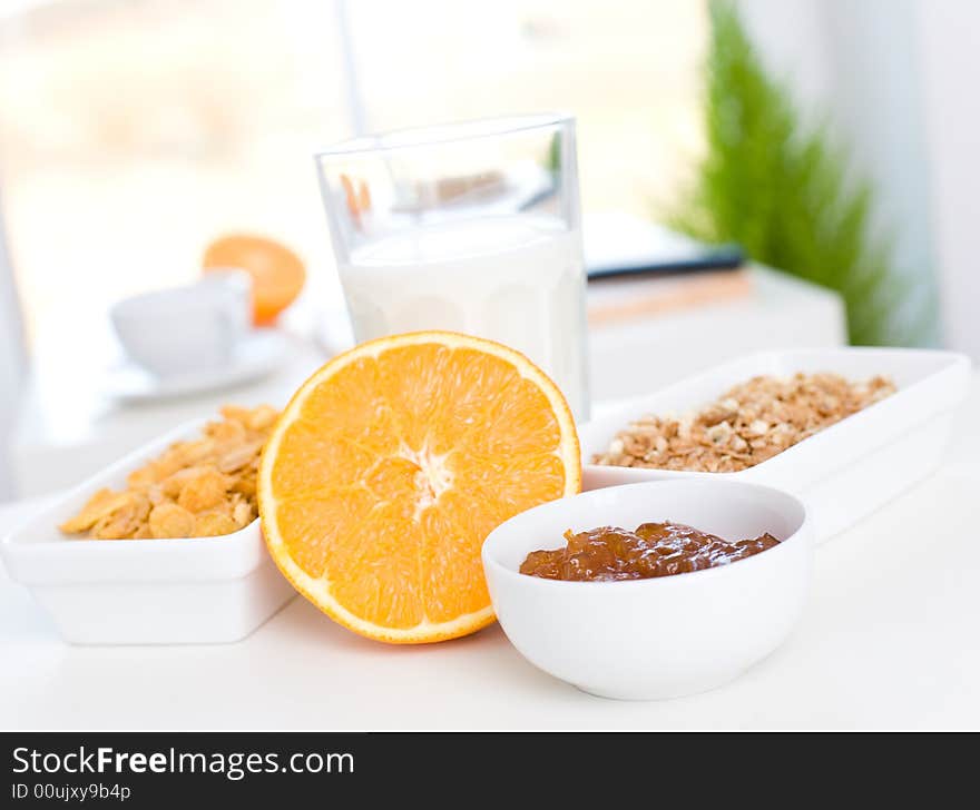 Jam, orange, cornflakes and milk / Fast and delicious breakfast. Jam, orange, cornflakes and milk / Fast and delicious breakfast