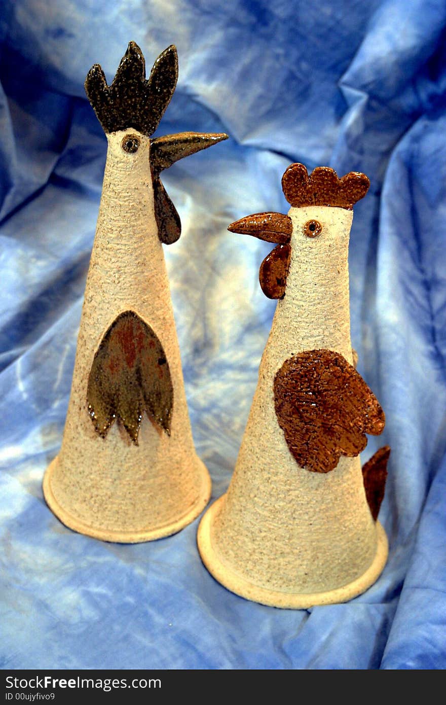 Two ceramic cocks