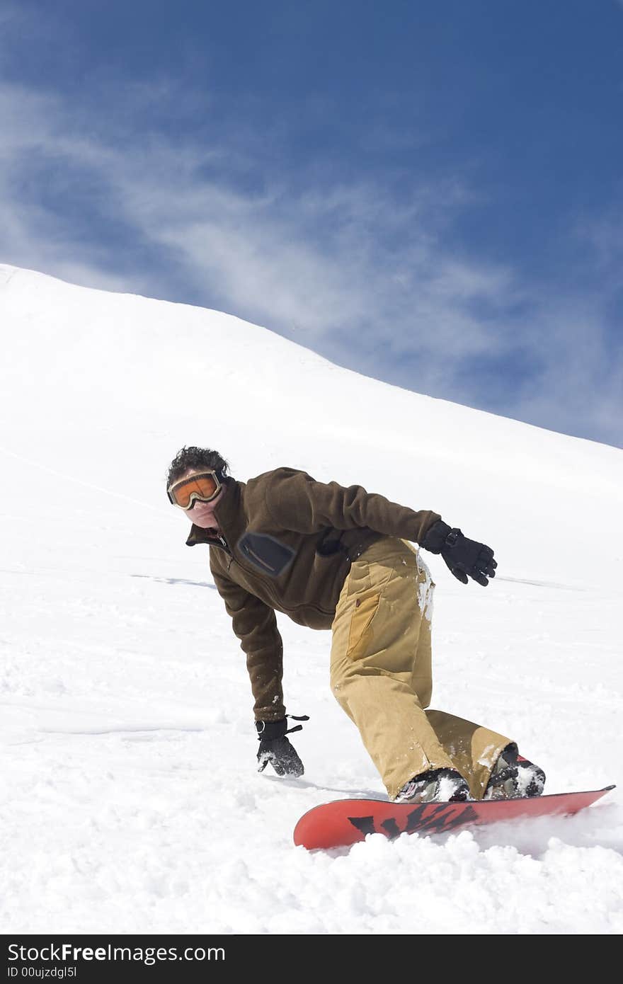 Snowboarder boarding in fresh snow