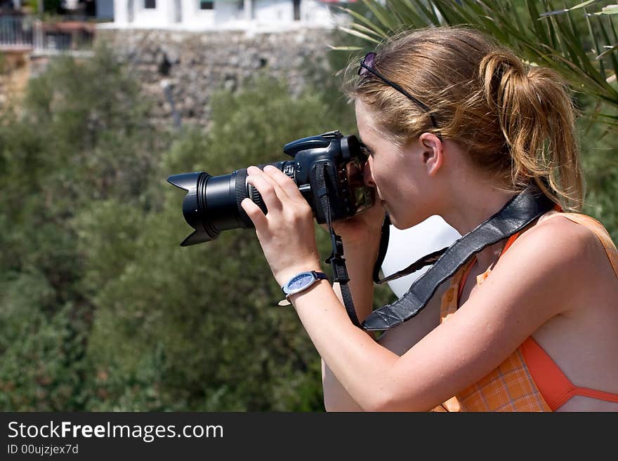 Young woman making photos on summer sun. Young woman making photos on summer sun