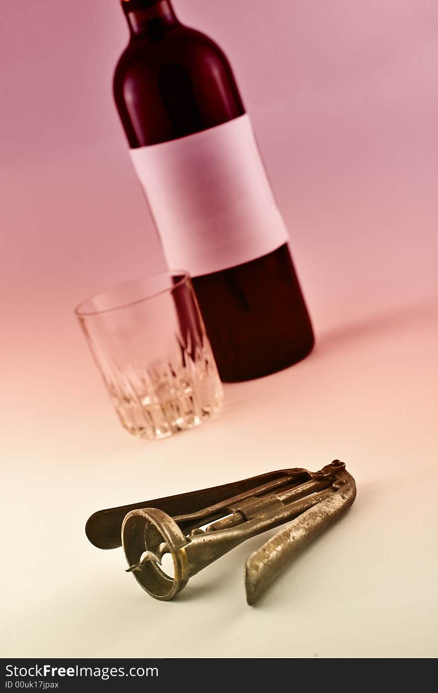 Wine bottle and metal corkscrew