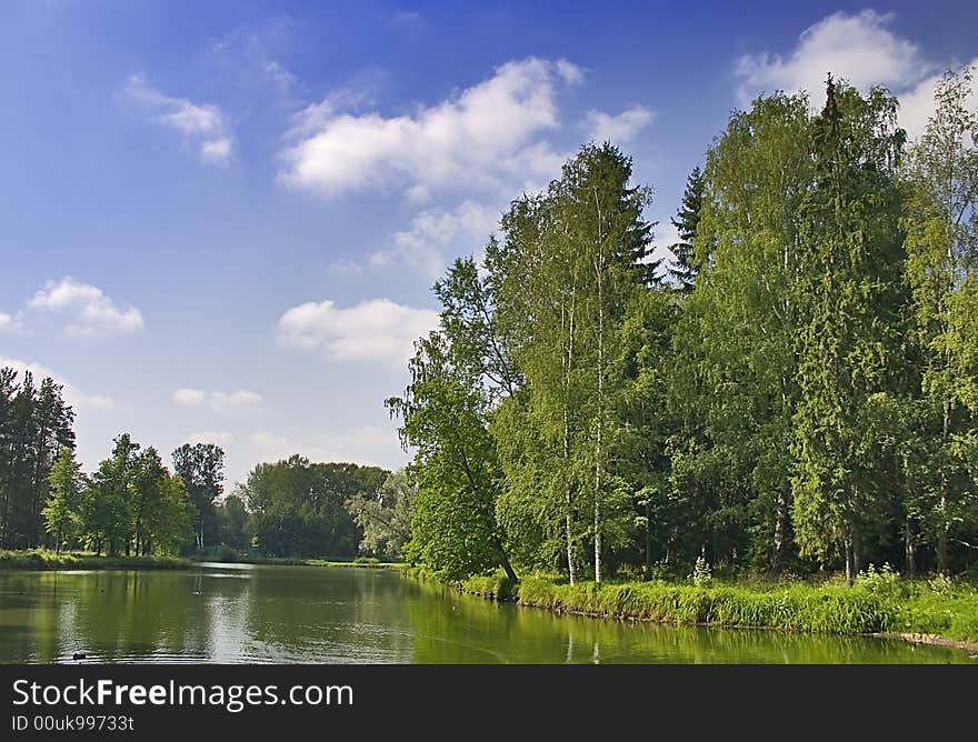 Landscape with blue sky, clouds, forest and lake. Landscape with blue sky, clouds, forest and lake