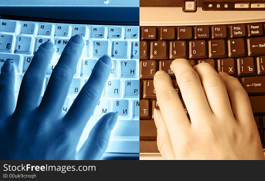 Human hands typing on the keyboard