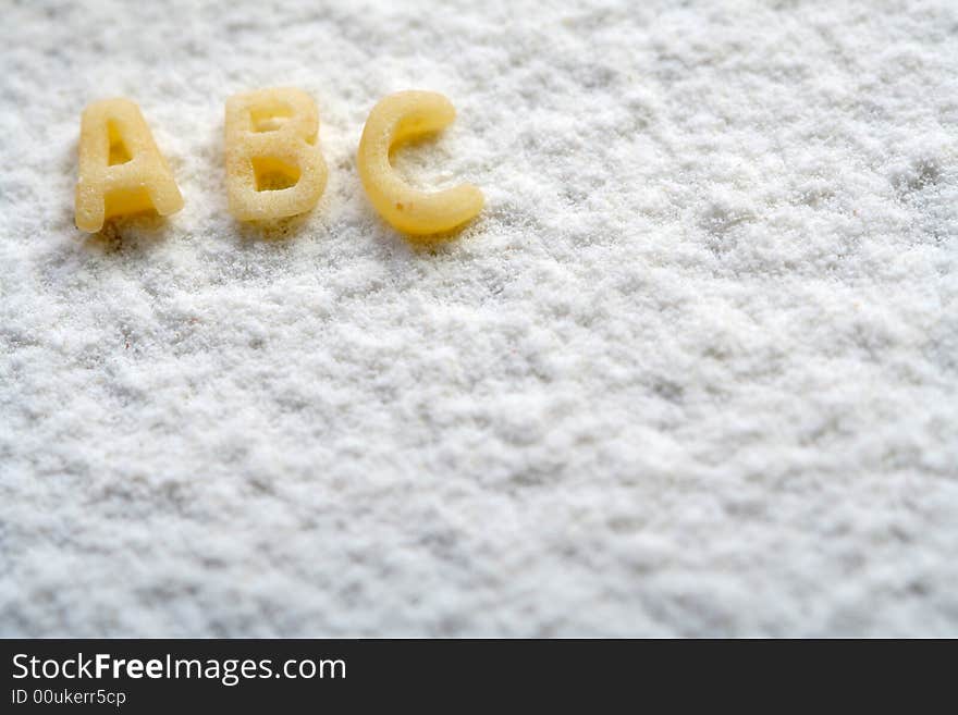 Eatable alphabet on flour, education