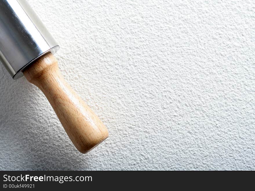 Rolling pin on wheat flour