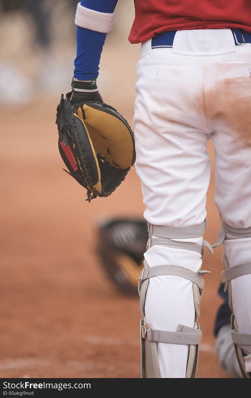 Baseball catcher watching the play develop