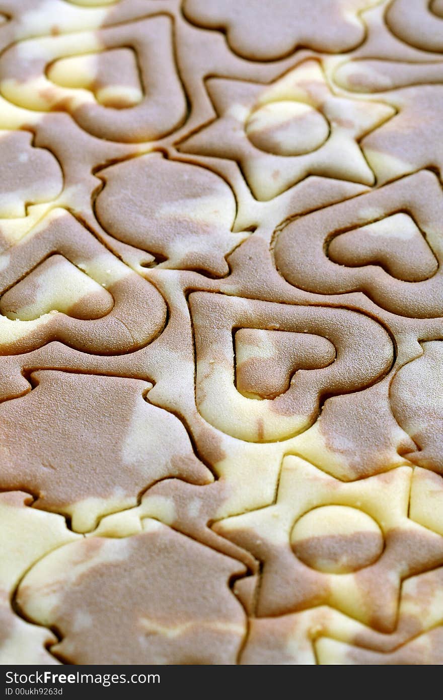 Various figures on a chocolate dough