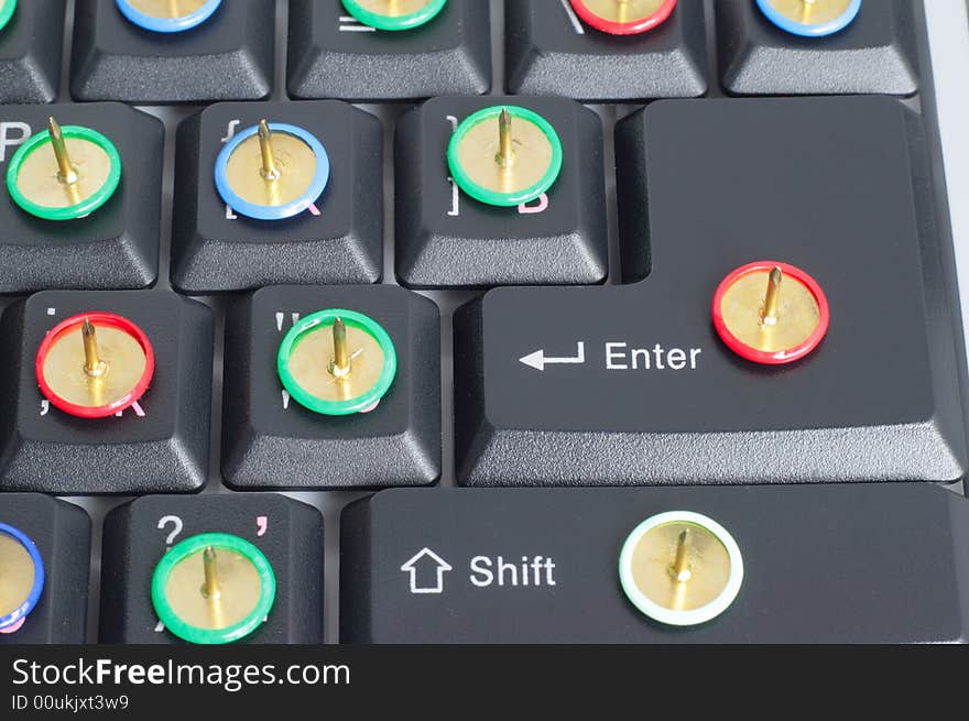 Computer keyboard with thumb tacks