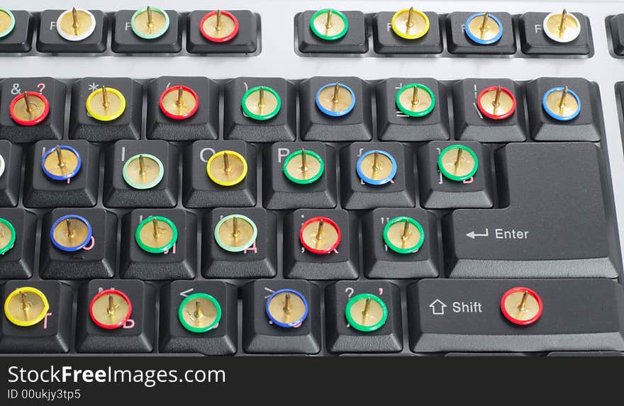 Computer keyboard with thumb tacks