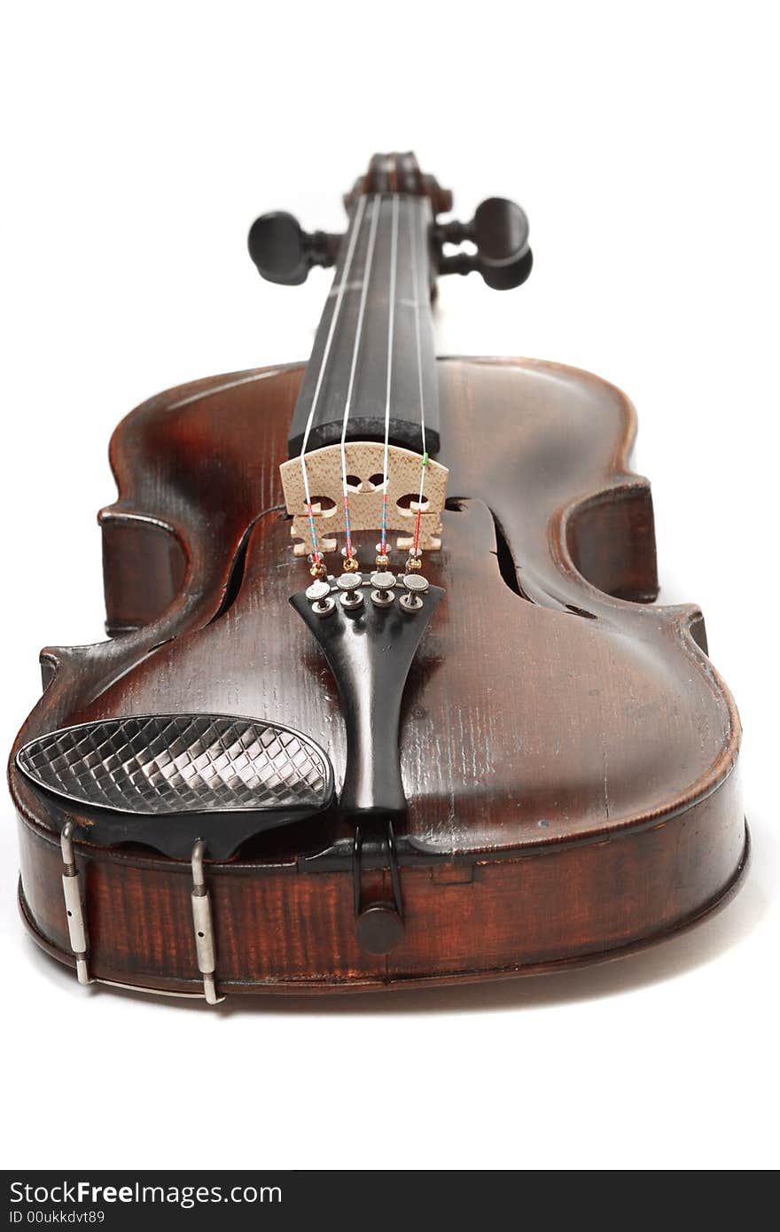 Looking down a violin at low angle with isolated background. Looking down a violin at low angle with isolated background.