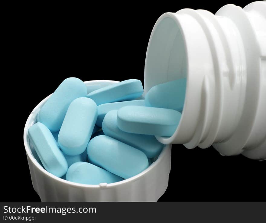 Blue tablets in white can