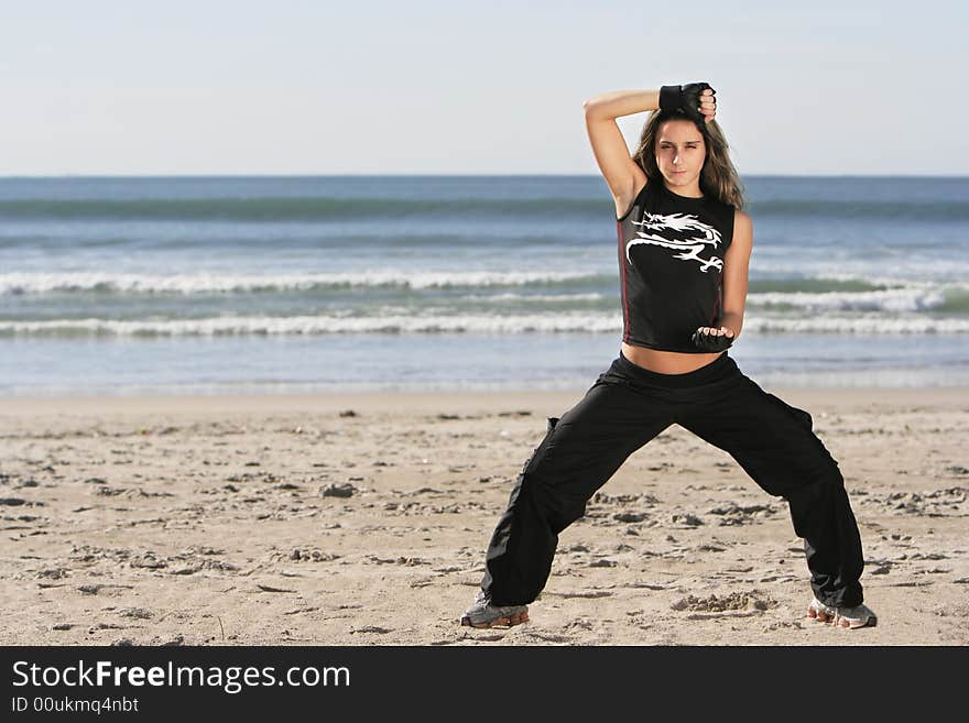 Girl fighting in a the beach