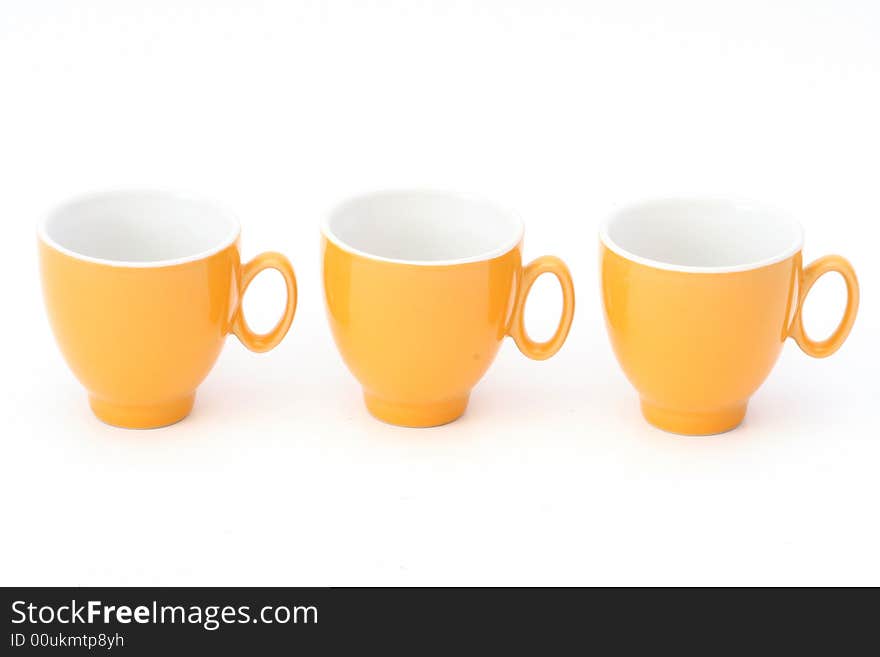 Mixture of orange CUPS on a white background