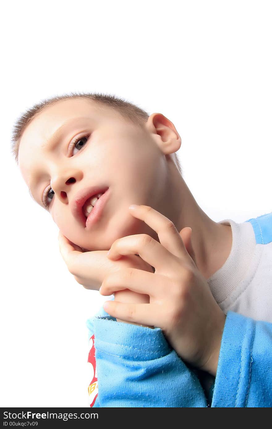 Little toughtful blond boy on the white background. Little toughtful blond boy on the white background