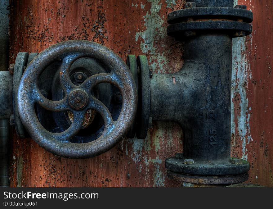 A detail of a rusty old gas gate. A detail of a rusty old gas gate