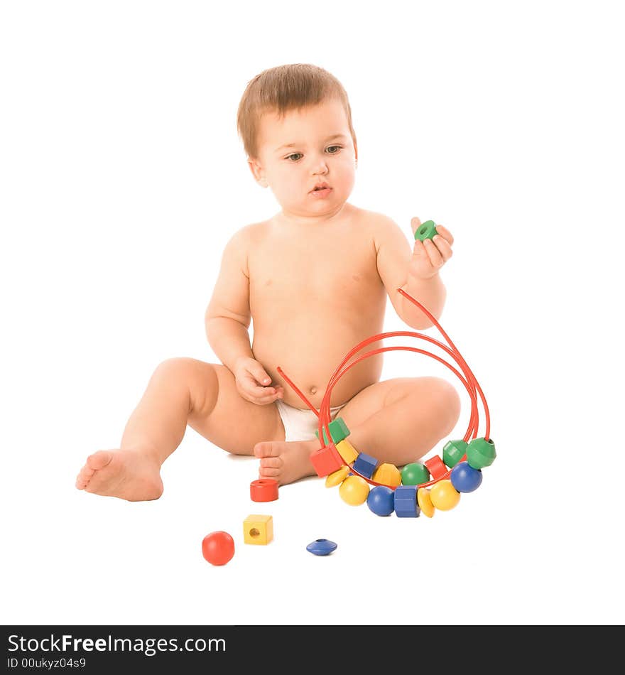 A toddler playing with a multicolored toy. A toddler playing with a multicolored toy