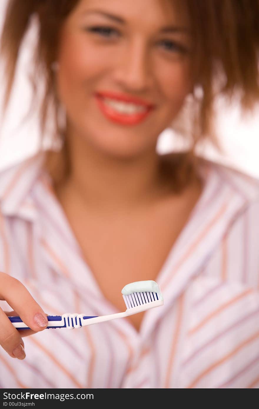 Beautiful girl with tooth-brush isolated over white