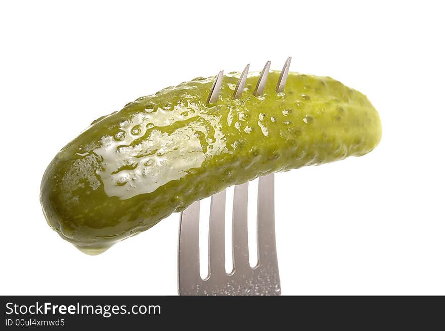 Salted cucumber on fork